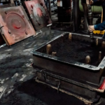 making sand mold in a flask on a foundry floor